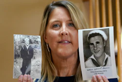 Teri Mann Whyatt displays photos of her uncle, William Edward Mann, who died on the USS Arizona during the bombing of Pearl Harbor, at her home Wednesday, July 14, 2021, in Newcastle, Wash. In recent years, the U.S. military has taken advantage of advances in DNA technology to identify the remains of hundreds of sailors and Marines who died in the 1941 bombing of Pearl Harbor.