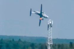 In this handout photo taken from video provided by Dmitry Ovchinnikov, the new light military transport burning plane Il-112V flies down near Kubinka airfield about 45 kilometers (28 miles) west of Moscow, Aug. 17, 2021.