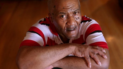 Michael Williams sits for a portrait in his South Side Chicago home Tuesday, July 27, 2021. Williams was behind bars for nearly a year before a judge dismissed the murder case against him in July at the request of prosecutors, who said they had insufficient evidence.