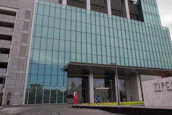 In this Sept. 2, 2020 file photo, the TIPCO tower stands in Bangkok, Thailand. One of Asia's biggest asphalt companies, Tipco Asphalt, is helping Venezuela skirt harsh U.S. sanctions by moving hundreds of millions of dollars on behalf of the state-run oil company PDVSA, according to an Associated Press investigation.