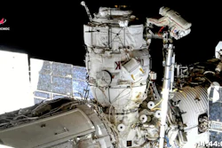 In this image taken from Roscosmos video, Russian cosmonauts Oleg Novitsky, top, and Pyotr Dubrov, bottom, perform a spacewalk to replace old batteries outside the International Space Station, June 2, 2021.