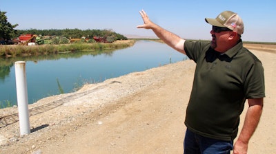 Kevin Spesert, public affairs and real estate manager for the Sites Project Authority, at the main canal of the Glenn Colusa Irrigation District near Sites, Calif., July 23, 2021.