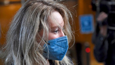 Elizabeth Holmes, founder and CEO of Theranos, arrives at the federal courthouse for jury selection in her trial, San Jose, Calif., Aug. 31, 2021.