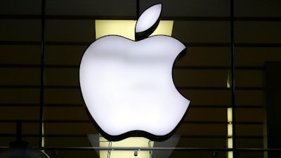 Apple logo illuminated at a store in Munich, Dec. 16, 2020.