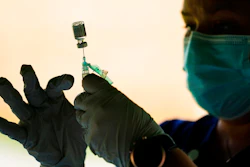 In this Sept. 14, 2021 photo, a syringe is prepared with the Pfizer COVID-19 vaccine at a clinic at the Reading Area Community College in Reading, Pa.