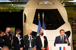 French President Emmanuel Macron speaks in front of a life-size replica of the next high-speed train TGV, at the Gare de Lyon station Friday, Sept. 17, 2021 in Paris.