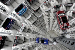 In this March 14, 2017 file photo Volkswagen cars are lifted inside a delivery tower of the company in Wolfsburg, Germany. German automaker Daimler on Friday dismissed a “cease and desist” demand from two environmental groups to commit to ending the sale of combustion engine vehicles by 2030.