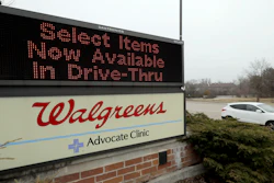 In this March 27, 2020, file photo, a Walgreens sign is displayed outside the store in Wheeling, Ill. Walgreens will hike starting pay to $15 an hour beginning in October, as employers across the United States continue boosting wages to attract workers.