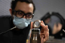 University of Cincinnati student Mohammad Saleem holds one of the novel jet engine nozzles UC designed in professor Ephraim Gutmark's lab. The U.S. Navy will test UC's design on F-18 Super Hornets this fall.