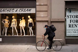 A retail location is for rent, Thursday, March 25, 2021, in the SoHo neighborhood of New York. The nation's business economists now expect slower economic growth this year due to the widespread delta variant of the coronavirus, while also saying the economy could improve more quickly next year as vaccinations become more accepted.