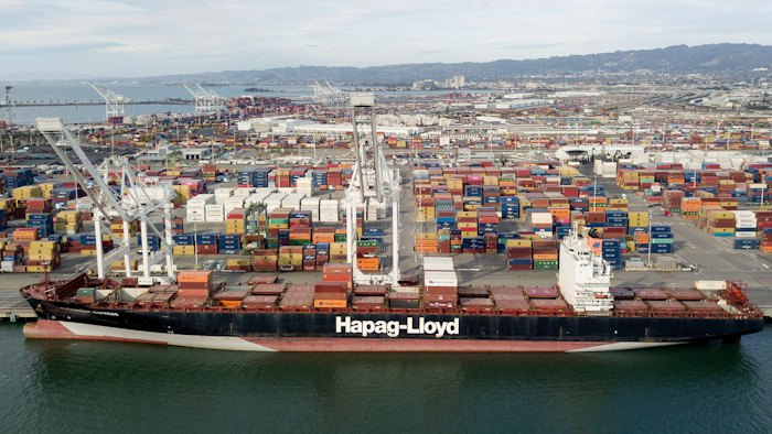 The Rotterdam Express is seen at the Port of Oakland, Wednesday, Oct. 6, 2021 in Oakland, Calif. The Rotterdam Express, a massive cargo ship made a series of unusual movements while anchored in the closest spot to a Southern California oil pipeline that ruptured and sent crude washing up on beaches, according to data collected by a marine navigation service.