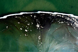 A floating barriers known as booms is set up to try to stop further incursion into the Wetlands Talbert Marsh after an oil spill in Huntington Beach, Calif., on Huntington Beach, Calif., on Monday, Oct. 4, 2021.