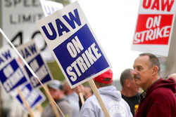 John Deere Dubuque Works union employee Steve Thor pickets outside UAW Local 94 in Dubuque, Iowa, on Oct. 14, 2021.