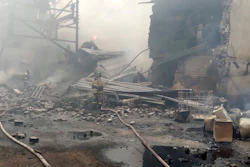 Emergency personnel work at the site of an explosion and fire at a gunpowder factory in the Ryazan region of Russia, Oct. 22, 2021.