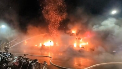 In this image taken from video by Taiwan's EBC, firefighters battle a blaze at a building in Kaohsiung, in southern Taiwan on Thursday, Oct. 14, 2021. A fire engulfed a 13-story building overnight in southern Taiwan, the island’s semi-official Central News Agency reported Thursday.