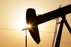 In this Wednesday, Sept. 30, 2015 file photo, an oil pump works at sunset in the desert oil fields of Sakhir, Bahrain. A U.N.-backed study has found that the world needs to cut by more than half its production of coal, oil and gas in the coming decade to maintain a chance of keeping global warming from reaching dangerous levels.