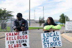Larry Gamble, who has worked at the Kellogg plant for 13 years, and Sharnita Childress, who has worked at the plant for 8 years, picket with other union workers outside of the plant in Battle Creek, Mich. on Tuesday, Oct. 19, 2021. Around 1,400 union workers from Michigan, Tennessee, Pennsylvania and Nebraska have been on strike for the past two weeks.