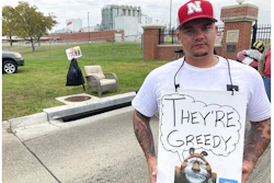 Michael Shlee, a bulk unloader at a Kellogg's cereal plant, pickets outside the facility's main entrance on Wednesday, Oct. 6, 2021, in Omaha, Neb. Workers have gone on strike after a breakdown in contract talks with company management.