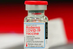 This Wednesday, Dec. 23, 2020 file photo shows a vial of the Moderna COVID-19 vaccine in the first round of staff vaccinations at a hospital in Denver. On Thursday, Oct. 14, 2021, U.S. health advisers said that some Americans who received Moderna’s COVID-19 vaccine should get a half-dose booster to bolster protection against the virus.