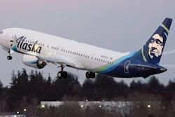 In this Monday, March 1, 2021 file photo, The first Alaska Airlines passenger flight on a Boeing 737-9 Max airplane takes off on a flight to San Diego from Seattle-Tacoma International Airport in Seattle. A Boeing pilot involved in testing the 737 Max jetliner was indicted Thursday, Oct. 14,2021 by a federal grand jury on charges of deceiving safety regulators who were evaluating the plane, which was later involved in two deadly crashes.