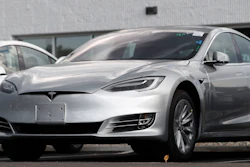 This July 8, 2018 photo shows Tesla 2018 Model 3 sedans sit on display outside a Tesla showroom in Littleton, Colo. Tesla wants to keep secret its response to the U.S. government’s request for information in an investigation of its Autopilot partially automated driving system.