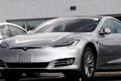 This July 8, 2018 photo shows Tesla 2018 Model 3 sedans sit on display outside a Tesla showroom in Littleton, Colo. Tesla wants to keep secret its response to the U.S. government’s request for information in an investigation of its Autopilot partially automated driving system.