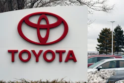 In this Sunday, March 21, 2021 file photo, the company logo adorns a sign outside a Toyota dealership in Lakewood, Colo. Nippon Steel Corp. is suing Toyota Motor Corp. over a patent for technology key for electric motors in a rare case of legal wrangling between Japan’s top steelmaker and automaker over intellectual property.