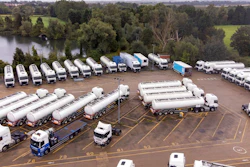 Trucks are parked as part of government's reserve tanker fleet based at a depot in Fenstanton, England, Saturday, Oct. 2, 2021. Military drivers will be deployed to deliver fuel to forecourts from Monday as the crisis at the pumps continues. The British government has extended an emergency visa program for truck drivers as fuel shortages frustrate motorists lining up at empty pumps.