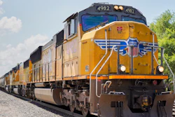 In this July 31, 2018, file photo, a Union Pacific train travels through Union, Neb. Union Pacific and its labor unions are suing each other to determine whether the railroad has the authority to require its employees to get vaccinated against the coronavirus.