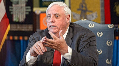 In this March 12, 2020, file photo, West Virginia Gov. Jim Justice speaks during a news conference at the State Capitol in Charleston, W.Va.