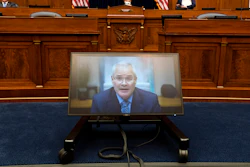 Darren Woods, CEO of ExxonMobil testifies via video conference during a House Committee on Oversight and Reform hearing on the role of fossil fuel companies in climate change, Thursday, Oct. 28, 2021, on Capitol Hill in Washington.
