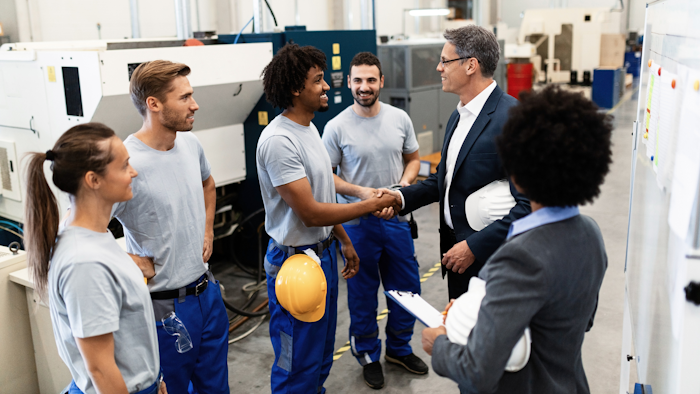 Happy Corporate Manager Shaking Hands With A Worker While Visiting A Factory 1151857619 2125x1417