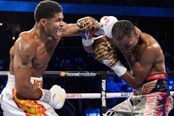 Shakur Stevenson, left, lands a punch on Jamel Herring during a junior lightweight boxing bout in Atlanta, Oct. 24, 2021.