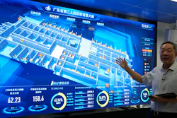 Tian Junzhang, president of Guangdong Second Provincial General Hospital, gestures in front of the monitoring screen of the hospital's cloud data center 'smart brain' in Guangzhou, China, Sept. 26, 2021.