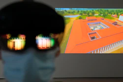 The image of an ancient temple reflected on a mixed-reality HoloLens headset worn by museum technician Kostas Baskakis at the Olympic Museum in Athens, Nov. 9, 2021.