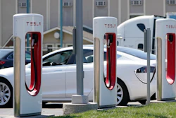 A Tesla charges at a station in Topeka, Kan., April 5, 2021. President Joe Biden and Democrats in Congress are looking to give U.S. automakers with union employees the inside track when it comes to winning the burgeoning electric vehicle market.