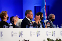 Britain's Alok Sharma, second left, President of the COP26 and Patricia Espinosa, left, UNFCCC Executive-Secretary applaud during the closing plenary session at the COP26 U.N. Climate Summit, in Glasgow, Scotland, Saturday, Nov. 13, 2021. Government negotiators from nearly 200 countries have adopted a new deal on climate action after a last-minute intervention by India to water down the language on cutting emissions from coal.