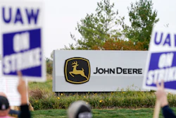 Members of the United Auto Workers strike outside of a John Deere plant, Wednesday, Oct. 20, 2021, in Ankeny, Iowa.