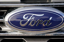In this April 25, 2021 file photograph, the blue oval logo of Ford Motor Company is shown in east Denver. Ford Motor Co. is in talks with a computer chip maker GlobalFoundaries Inc. to shore up its semiconductor supplies as it tries to avoid factory shutdowns in the future.