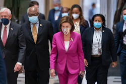 Speaker of the House Nancy Pelosi, D-Calif., center, joined from left by House Majority Leader Steny Hoyer, D-Md., and House Majority Whip James Clyburn, D-S.C., walks to update reporters after day of delays in the vote to advance President Joe Biden's $1.85 trillion-and-growing domestic policy package, at the Capitol in Washington, Friday, Nov. 5, 2021.