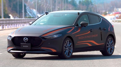 This photo provided by Mazda Motor Corp., shows the Mazda Co-Pilot Concept car in Miyoshi, Hiroshima prefecture, western Japan, on Sept. 30, 2021. Cars already know how to park themselves, warn drowsy drivers, steer back into the right lanes and propose map routes to destinations.
