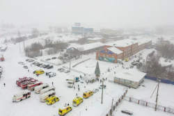 Ambulances and fire trucks are parked near the Listvyazhnaya coal mine out of the Siberian city of Kemerovo, about 3,000 kilometres (1,900 miles) east of Moscow, Russia, Thursday, Nov. 25, 2021.