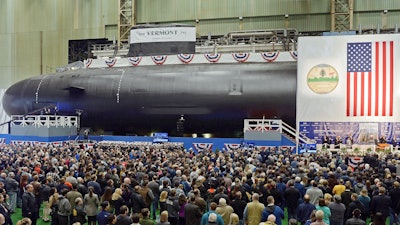 The United States Navy's nuclear-powered attack submarine USS Vermont is christened at Electric Boat in Groton, Conn., Oct. 20, 2018. A metallurgist in Washington state pleaded guilty to fraud Monday, Nov. 8, 2021, after she spent decades faking the results of strength tests on steel that was being used to make U.S. Navy submarines.