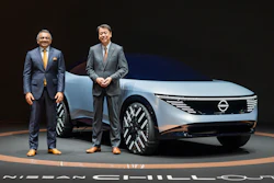In this photo provided by Nissan Motor Co., Chief Executive Makoto Uchida, right, and COO Ashwani Gupta, left, pose with a Nissan Chill-Out concept car on Nov. 27, 2021.