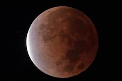 The earth's shadow covers the full moon during a partial lunar eclipse, early Friday, Nov. 19, 2021, in Kansas City, Mo. NASA and the nation's top federal nuclear research lab on Friday, Nov. 19, put out a request for proposals for a fission surface power system.