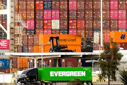 A truck passes a container ship at the Port of Oakland on Tuesday, Oct. 19, 2021, in Oakland, Calif. California farmers say they are having trouble exporting their crops because of delays in the global supply chain. Intense demand for products has led to a backlog of container ships outside the nation's two largest ports along the Southern California coast.