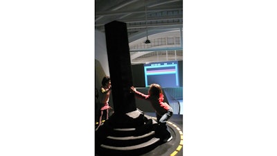 Two girls operate the Giant Joystick at LABoral Art and Industrial Creation Centre, March 31, 2007 in Asturias, Spain.