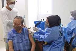 An elderly man receives a shot of the COVID-19 vaccine during a vaccination campaign at a community health center in Tangerang on the outskirts of Jakarta, Indonesia, Thursday, Oct. 28, 2021. Biotechnology company Novavax said Monday that Indonesia has given the world's first emergency use authorization for its COVID-19 vaccine, which uses a different technology than currently used shots.