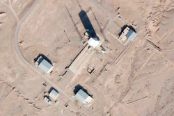 Satellite photo showing a support vehicle stands and large white gantry that typically houses a rocket at the Imam Khomeini Spaceport, Semnan province, Iran, Dec. 11, 2021.