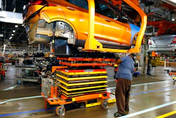 FILE - A battery is lifted into place for installation in the Chevrolet Bolt EV at the General Motors Orion Assembly plant, Nov. 4, 2016, in Orion Township, Mich. Michigan would create new economic development funds to help the state land major business expansions, including possible electric vehicle and battery plants, under fast-tracked bills that received initial approval Wednesday, Dec. 8, 2021.